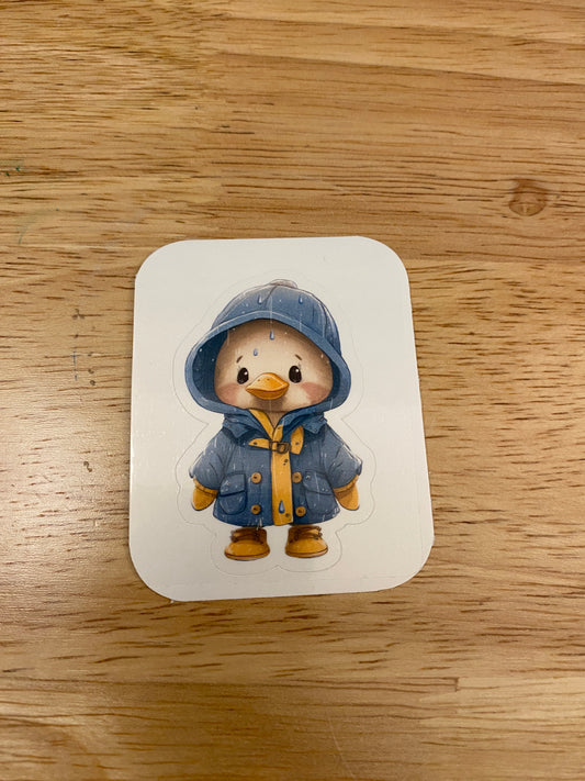 Yellow duck in blue rain jacket sticker
