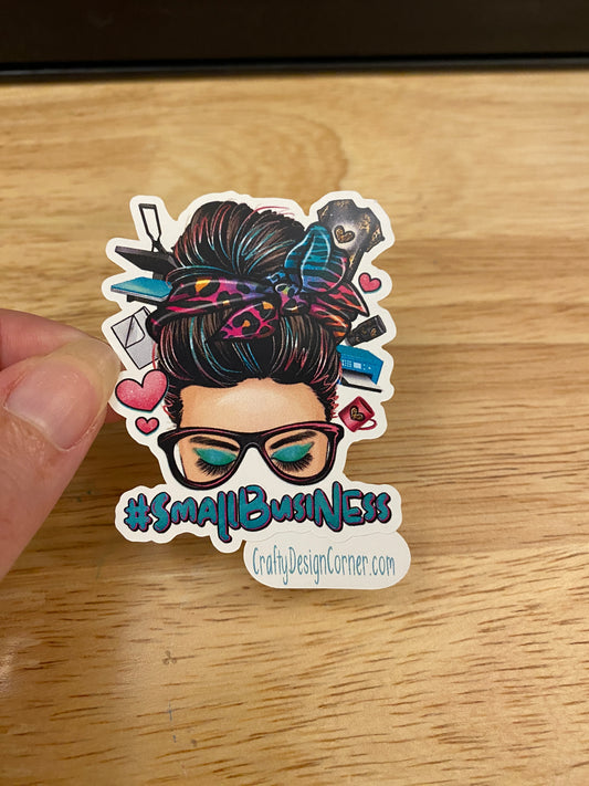 Small business lady with hair bun and glasses