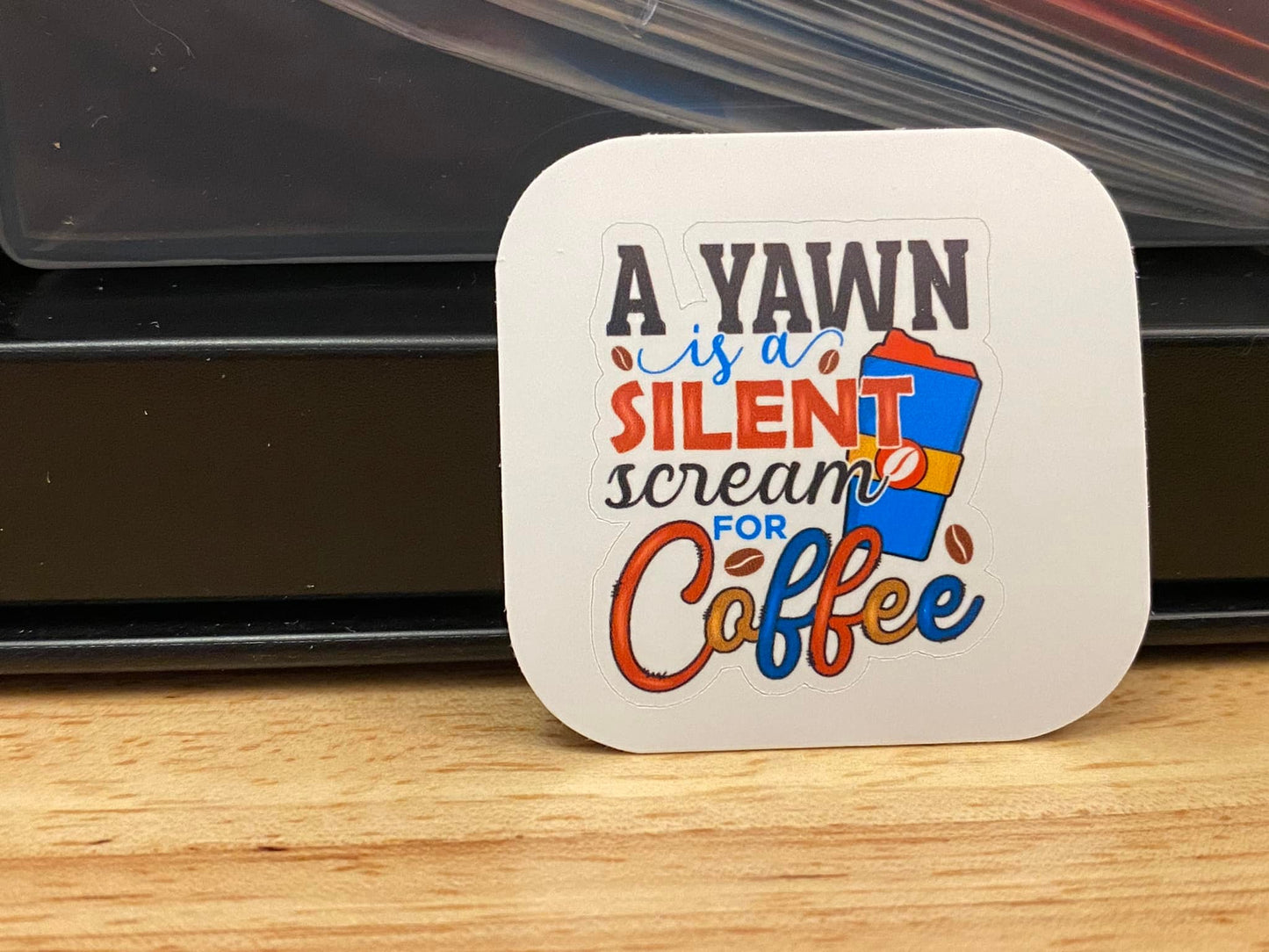 A Yawn is a Silent Scream for Coffee Sticker